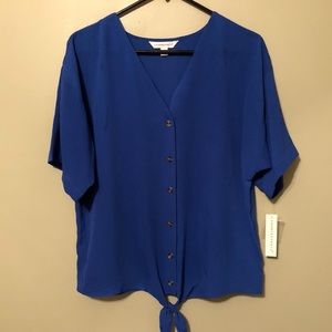 Classy & comfy! Pair with black leggings and boots! Long enough in front/back